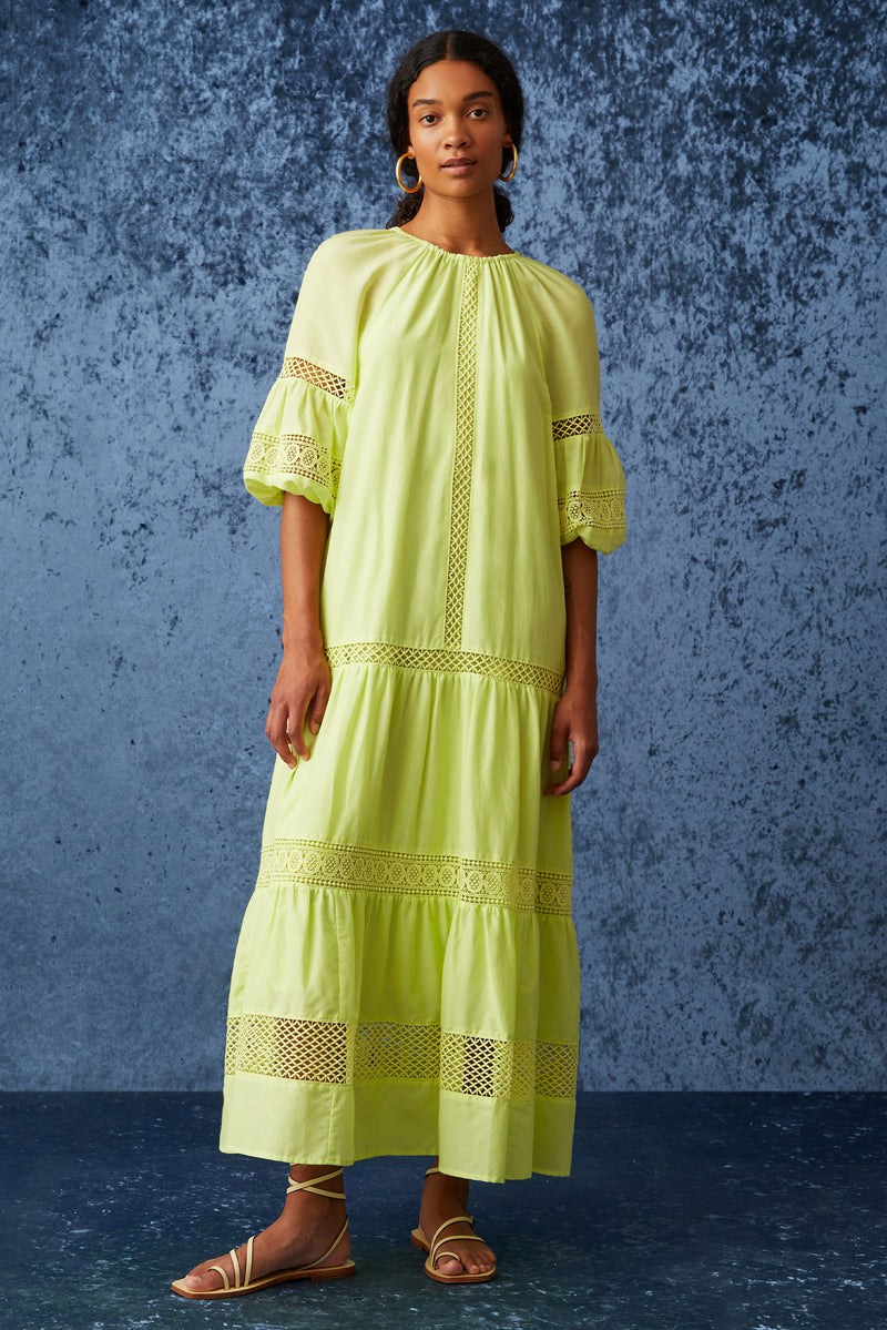 Solid bright green maxi dress with a flowy silhouette and tiered lace detailing throughout the skirt and on the sleeves
