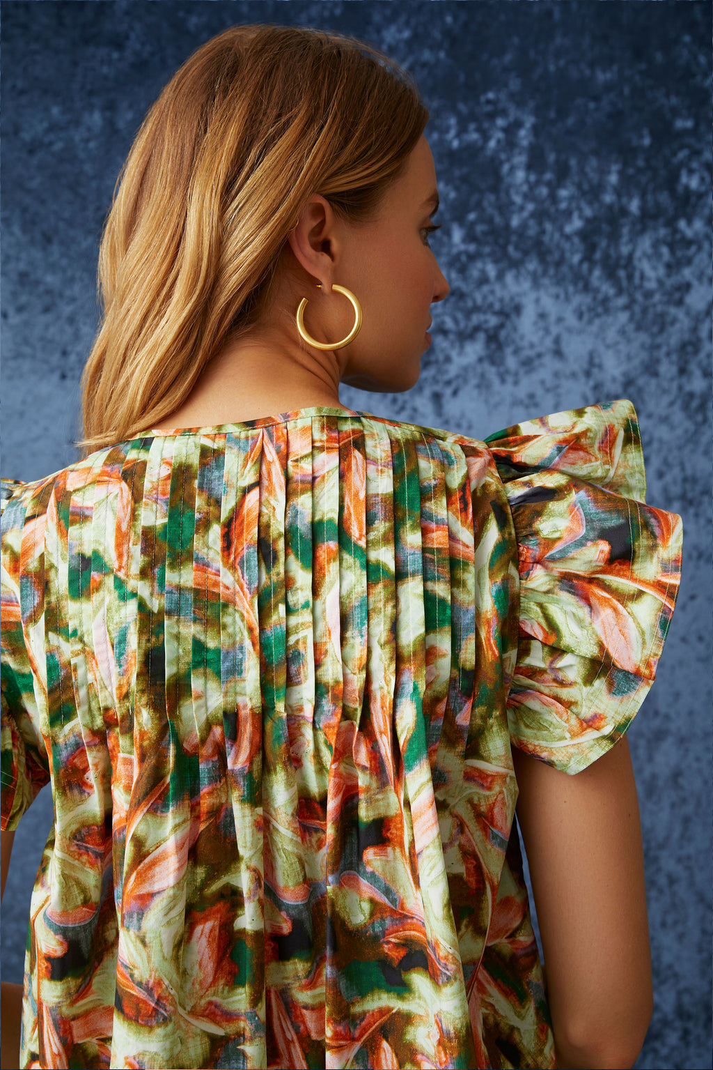 Green leaf like printed top with v-neck and optional tie closure
