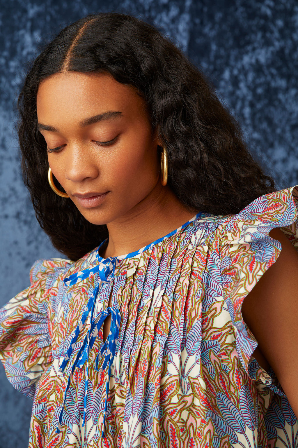 Blue and red floral printed top with v-neck and optional tie closure