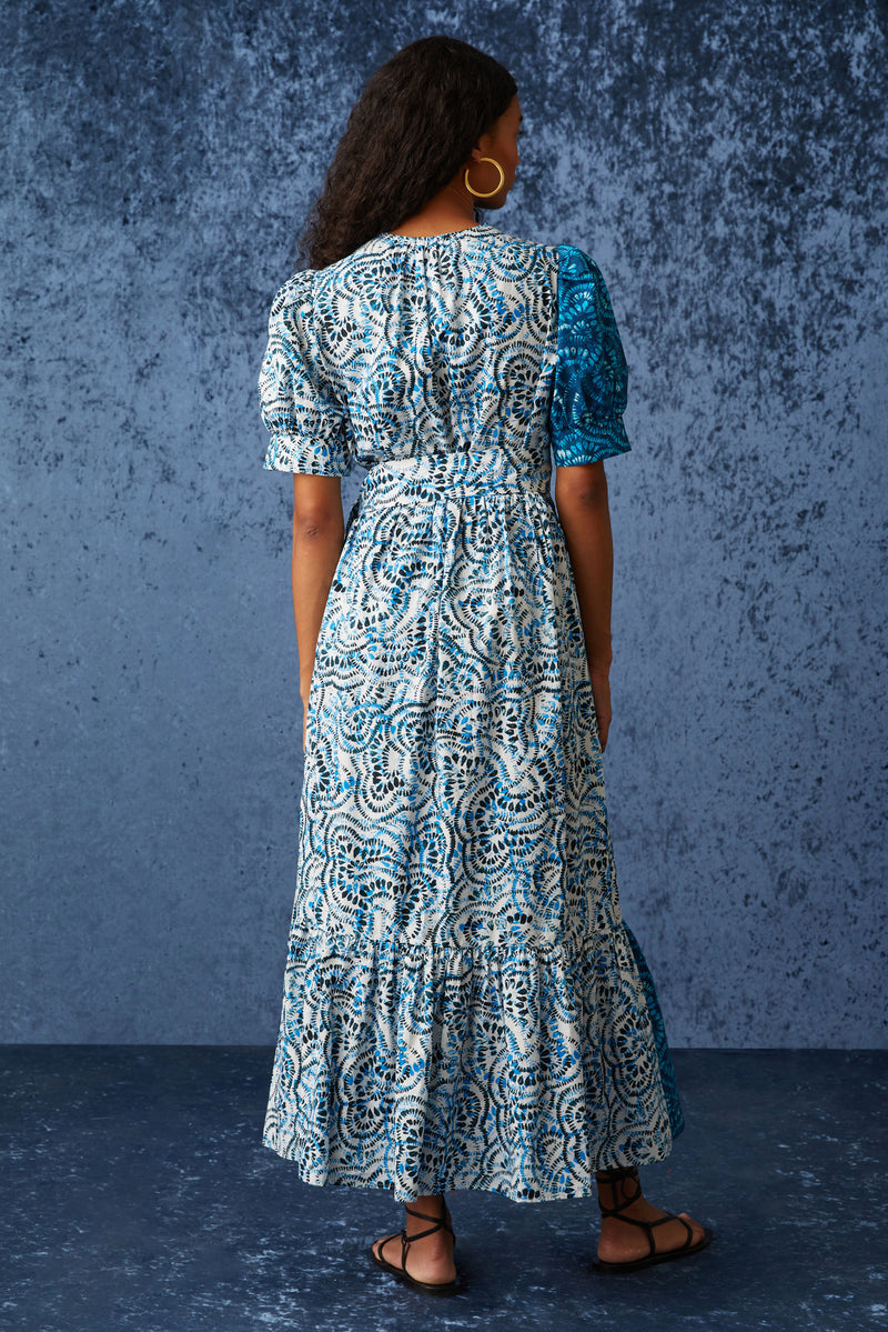 Maxi dress in a two tone blue geometric print with short puff sleeves that are cuffed at the bottom