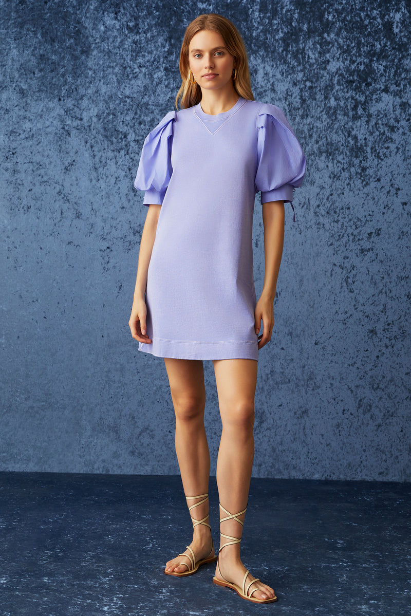 Short sweatshirt dress with rounded neckline and v-notch in a pastel purple color