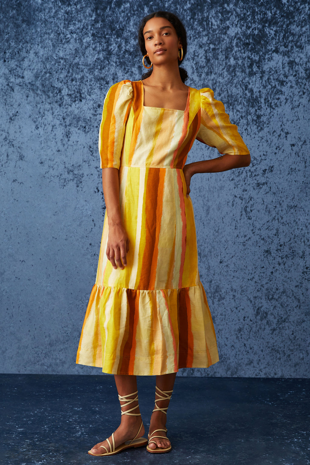 Orange and yellow striped long dress with three-quarter sleeves 