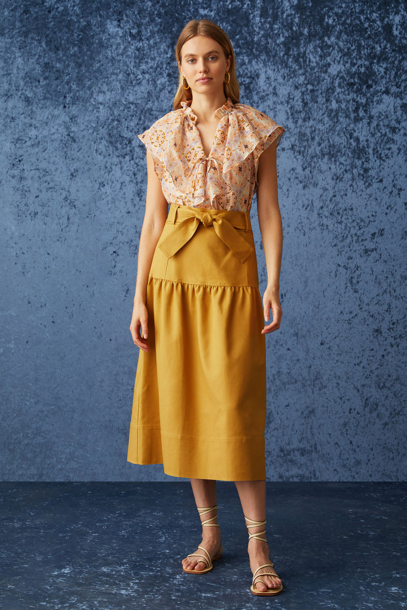 Solid golden bronze skirt with optional tie belt at the waist and straight silhouette