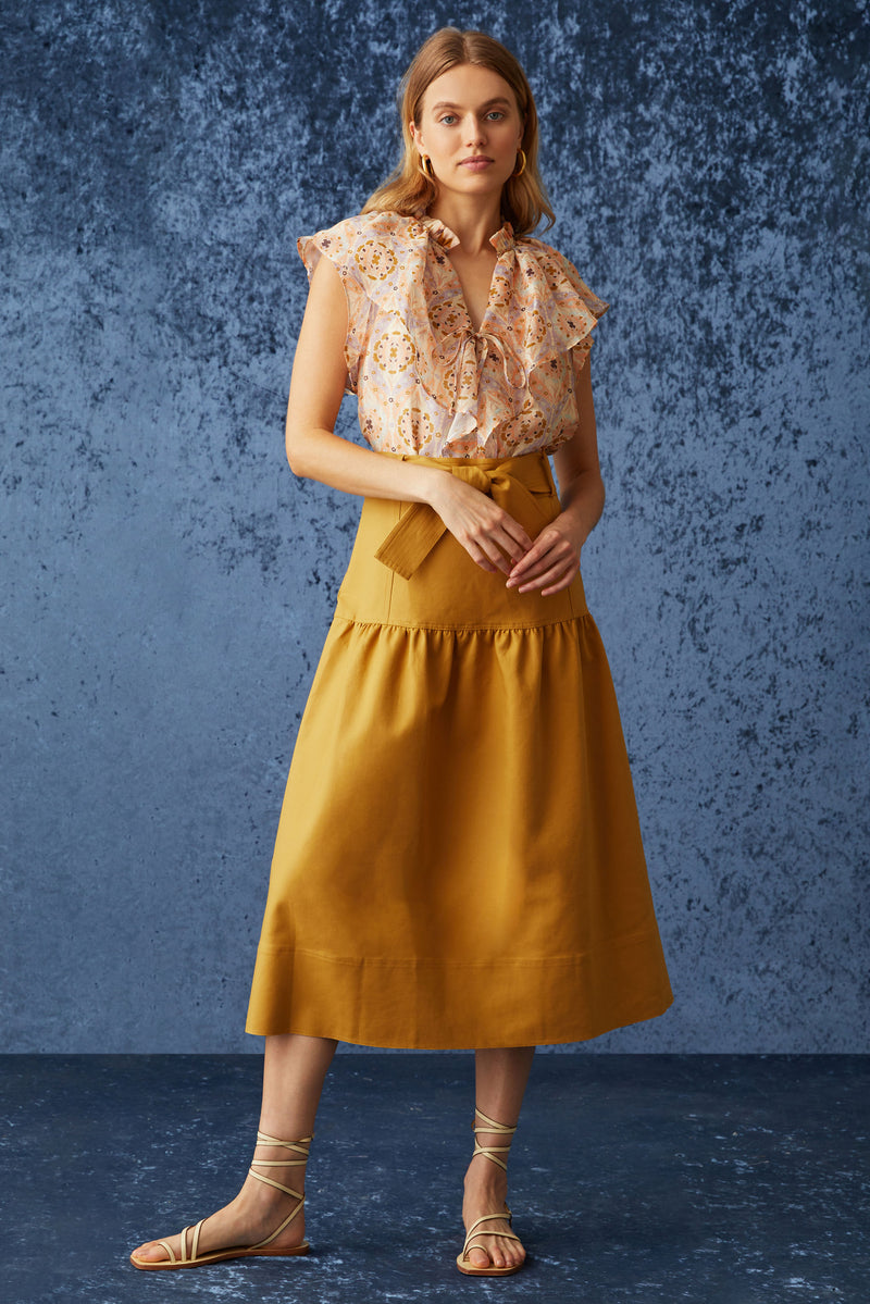 Solid golden bronze skirt with optional tie belt at the waist and straight silhouette