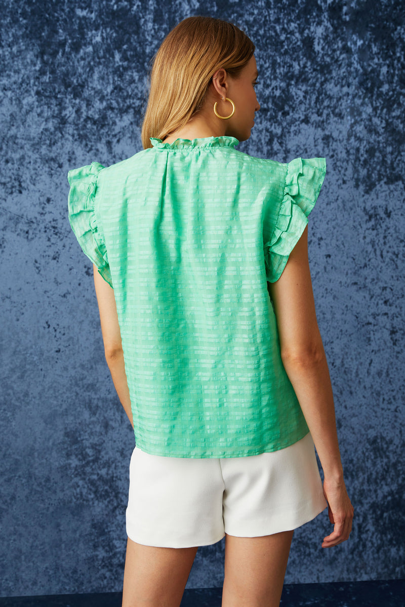 Short flutter sleeve top with a straight silhouette in a bright green color 
