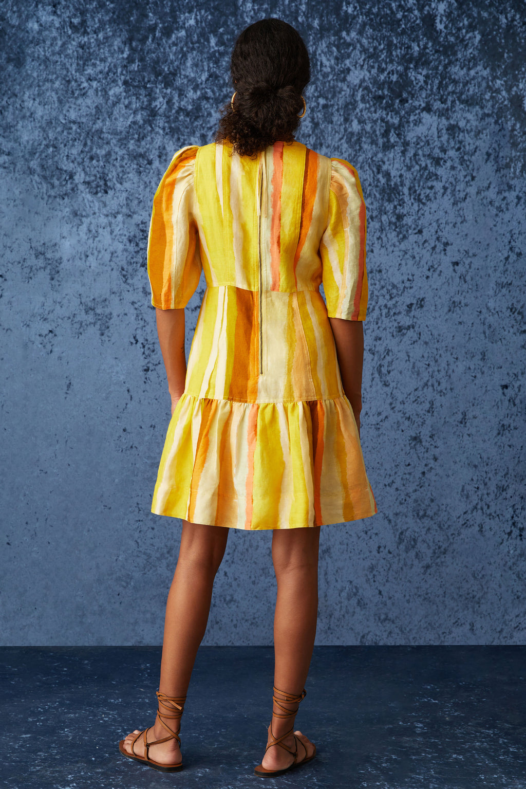 Orange and yellow striped print short dress with a slip on silhouette