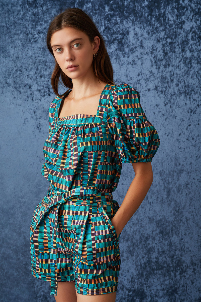 Fitted shorts in a blue and tan checkered print with functional pockets and tie sash belt