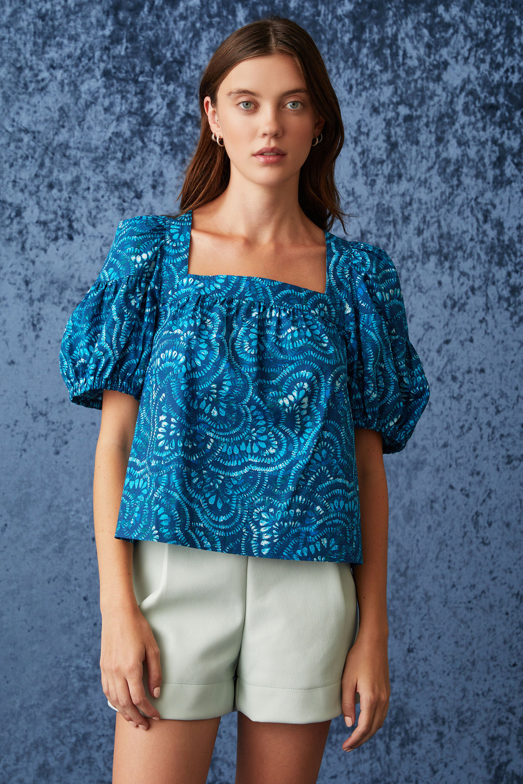 Dark blue geometric swirl top with puff sleeves