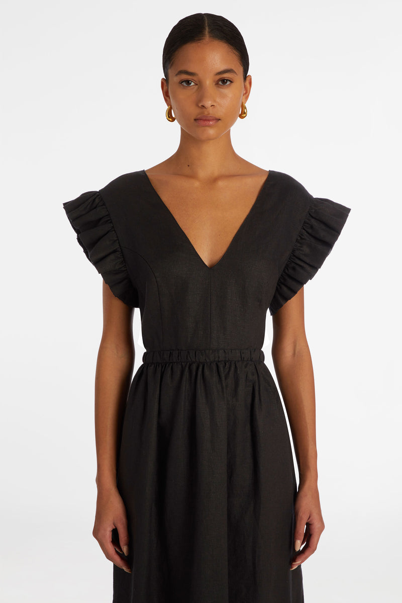 Solid black sleeveless maxi dress with ruffle on the shoulder
