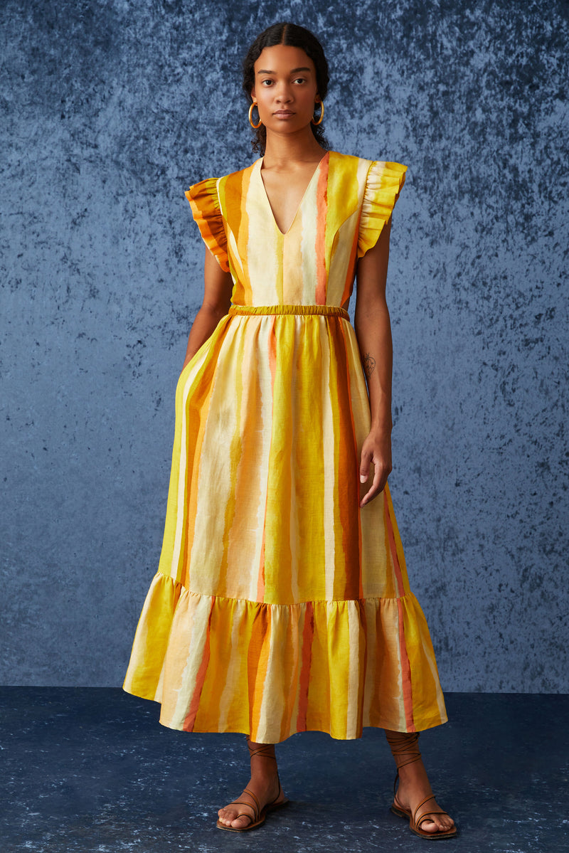 Long dress with a v-neckline and ruffled short sleeves that is cinched at the waist