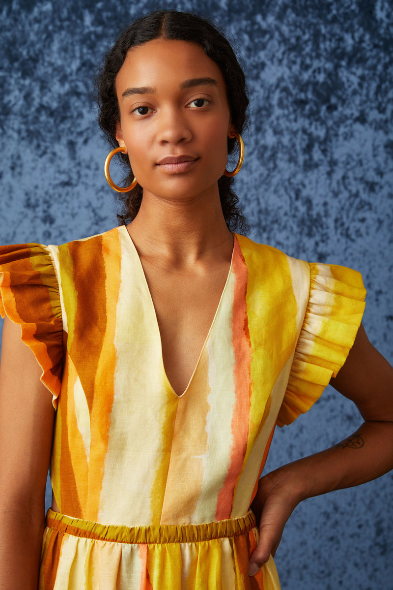 Orange and yellow vertical stripe print maxi dress with v-neckline in the front and back of the dress