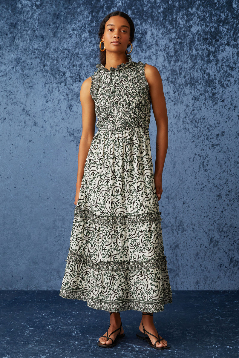 Maxi dress with high neckline with rounded ruffled neckline in a green and white floral embroidery