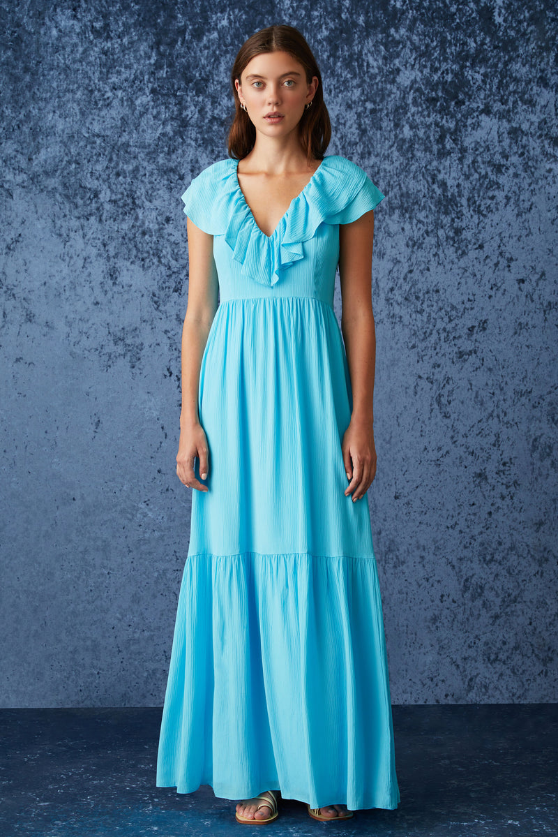 Maxi dress in a bright blue color with v-neckline in both front and the back with a tie at the back 