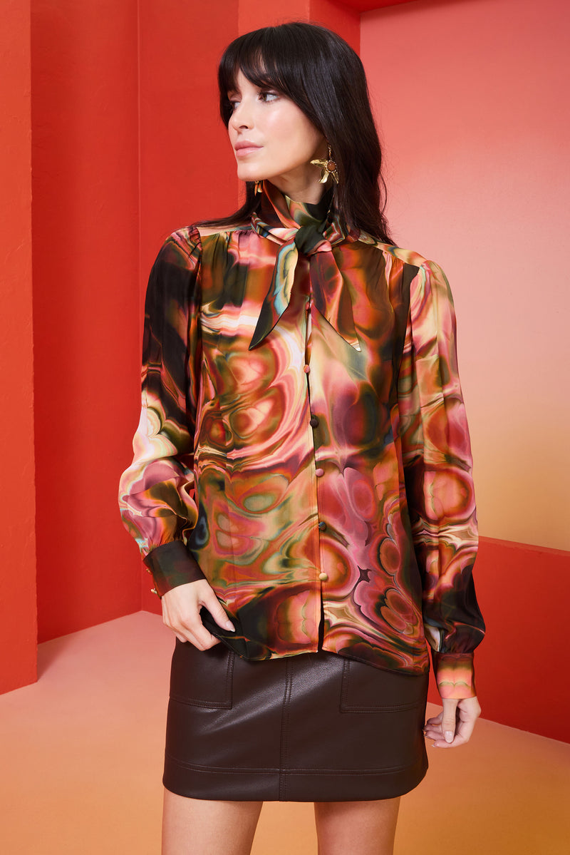 button front long sleeve blouse that is cuffed at the wrists
