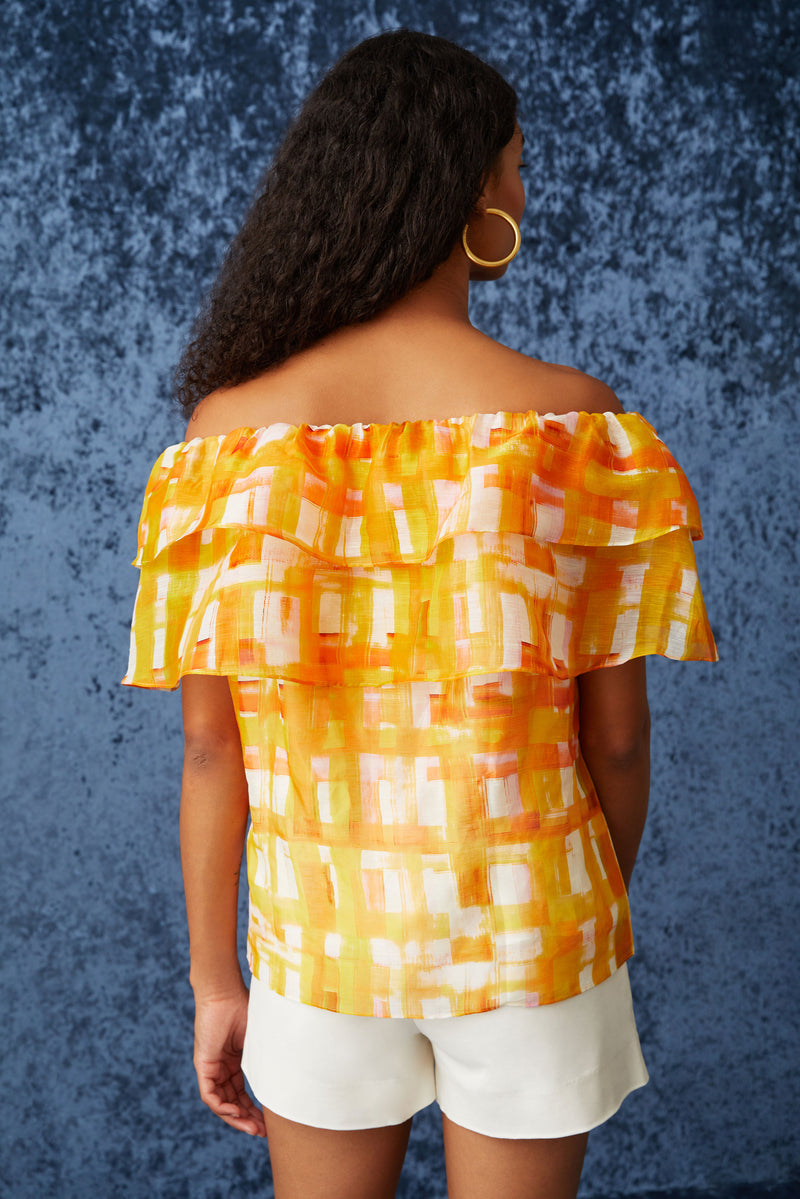 Off the shoulder top with ruffles going around the top of the blouse