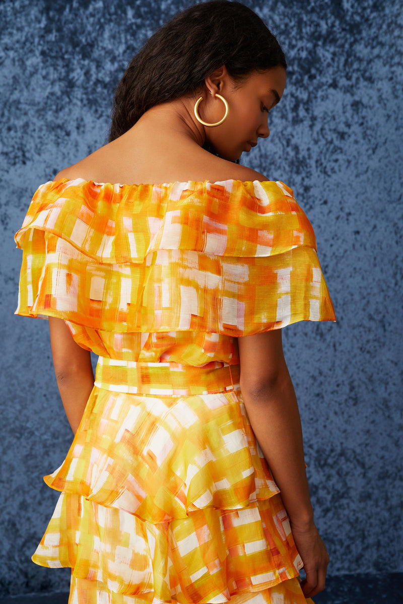 Off the shoulder top in a golden yellow and white checkered print 
