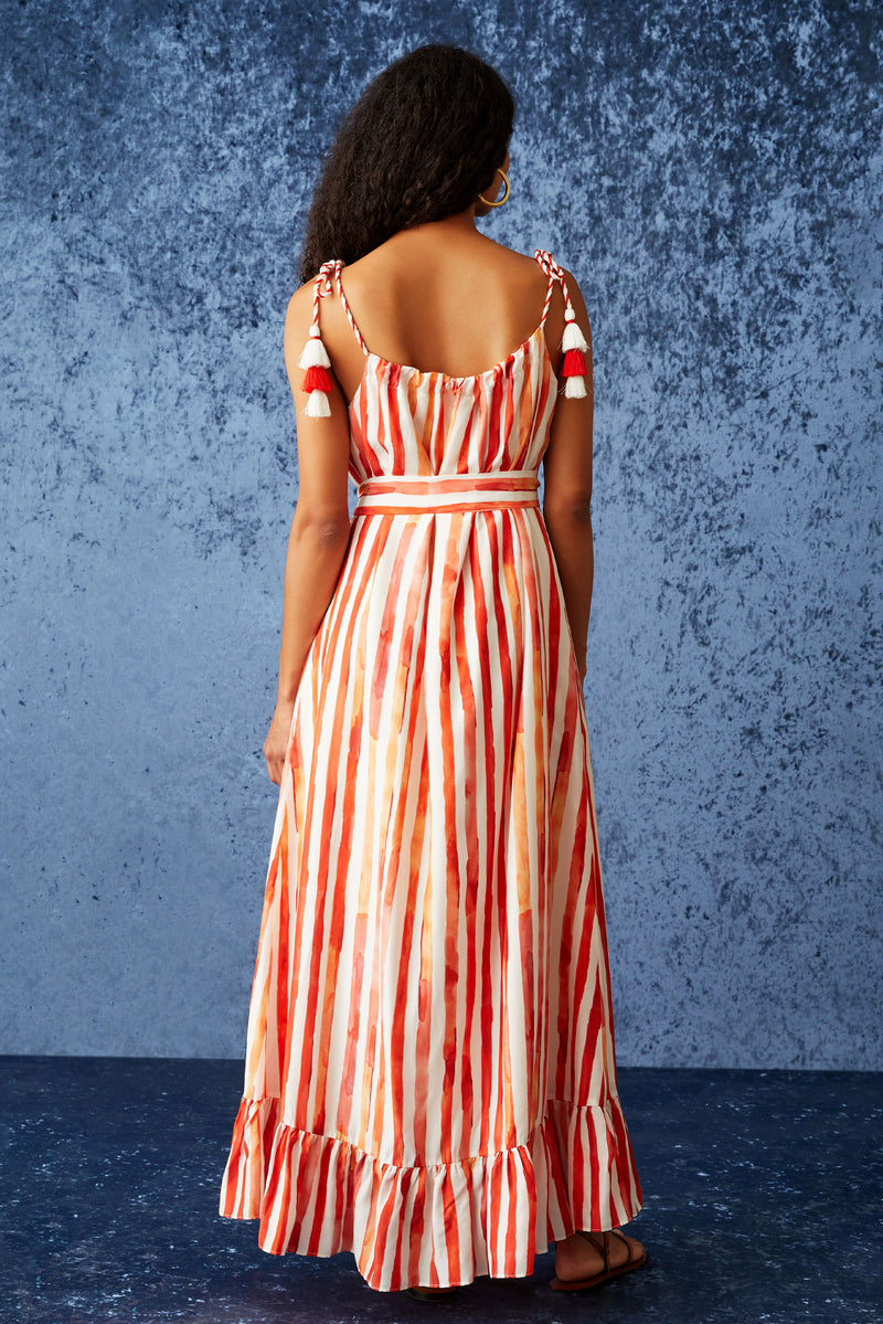 Maxi dress with adjustable ties at the shoulder and tassels at the end of the ties