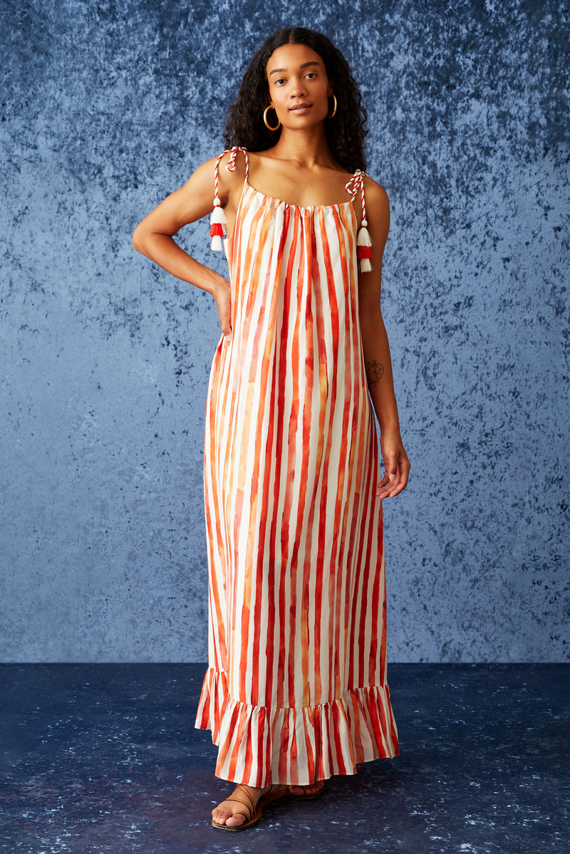 Maxi dress with adjustable braided tassel tie straps in a red and white striped print 